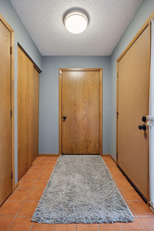 2436 Mendelssohn Ln N, Golden Valley, MN 55427 - hall with light tile patterned floors and a textured ceiling