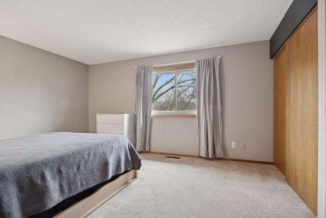 2436 Mendelssohn Ln N, Golden Valley, MN 55427 - bedroom with light colored carpet and baseboards