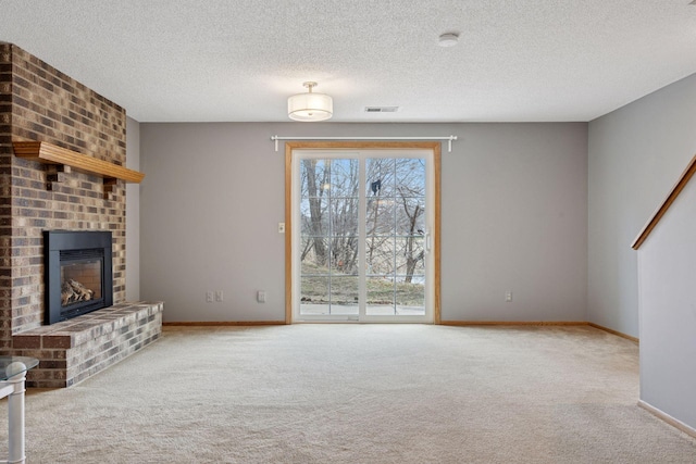 2436 Mendelssohn Ln N, Golden Valley, MN 55427 - unfurnished living room with carpet, baseboards, a fireplace, and a textured ceiling