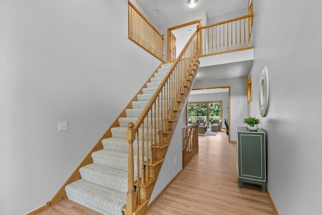 3868 Green Heights Trl SW, Prior Lake, MN 55372 - stairway featuring wood finished floors and a towering ceiling