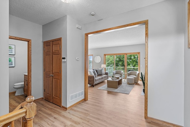 3868 Green Heights Trl SW, Prior Lake, MN 55372 - hall featuring light wood-style floors and a textured ceiling