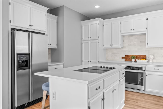 3868 Green Heights Trl SW, Prior Lake, MN 55372 - kitchen with stainless steel appliances, white cabinetry, light countertops, backsplash, and recessed lighting