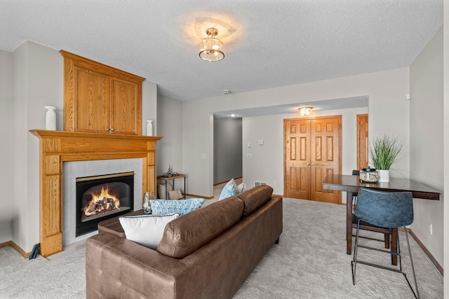3868 Green Heights Trl SW, Prior Lake, MN 55372 - living area featuring light colored carpet, a textured ceiling, and a tiled fireplace