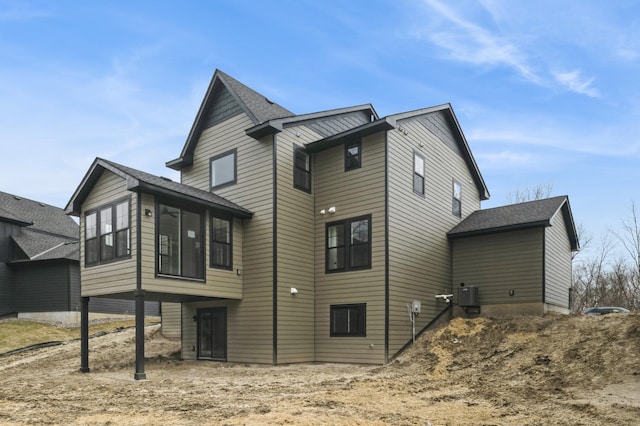 20141 63rd Ave, Corcoran, MN 55340 - back of house with a shingled roof and a sunroom