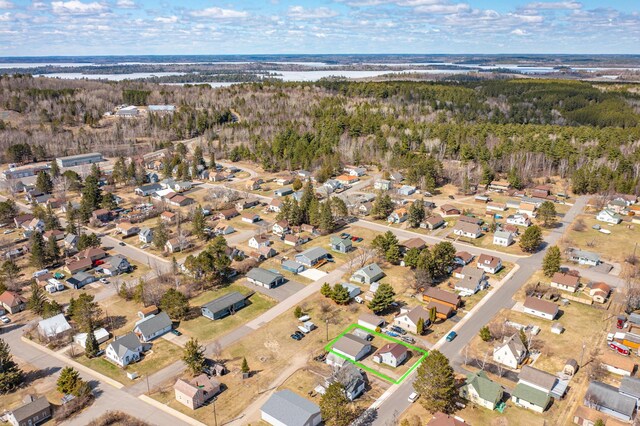 25 4th Ave, Soudan, MN 55782 - aerial view of property's location with nearby suburban area, property parcel outlined, and a forest