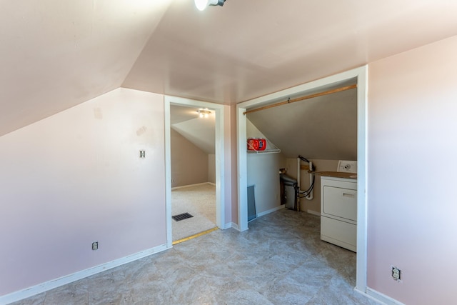 25 4th Ave, Soudan, MN 55782 - bonus room featuring washer / clothes dryer, lofted ceiling, light colored carpet, and baseboards