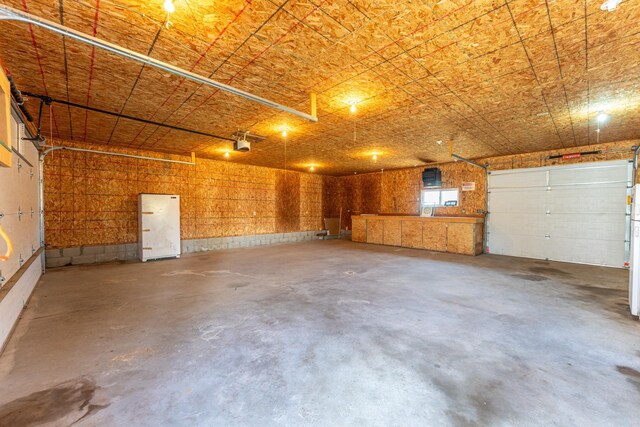 25 4th Ave, Soudan, MN 55782 - garage featuring a garage door opener