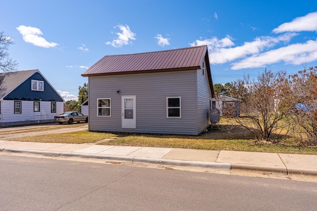 25 4th Ave, Soudan, MN 55782 - view of home's exterior with metal roof