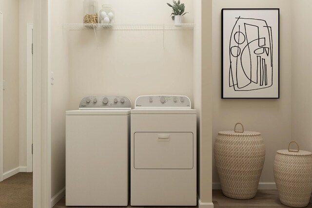 18736 Ivanhoe St NW, Elk River, MN 55330 - washroom featuring washing machine and clothes dryer and baseboards