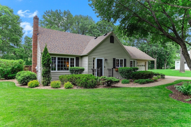 2657 Valley View Ln, New Brighton, MN 55112 - view of front of home with a garage, a front yard, a chimney, and roof with shingles