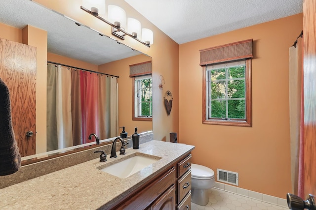 2657 Valley View Ln, New Brighton, MN 55112 - bathroom featuring vanity, a textured ceiling, tile patterned flooring, and curtained shower