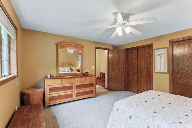 2657 Valley View Ln, New Brighton, MN 55112 - carpeted bedroom featuring two closets and a ceiling fan