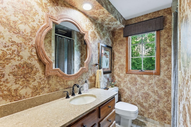 2657 Valley View Ln, New Brighton, MN 55112 - bathroom featuring wallpapered walls, vanity, and tile patterned floors