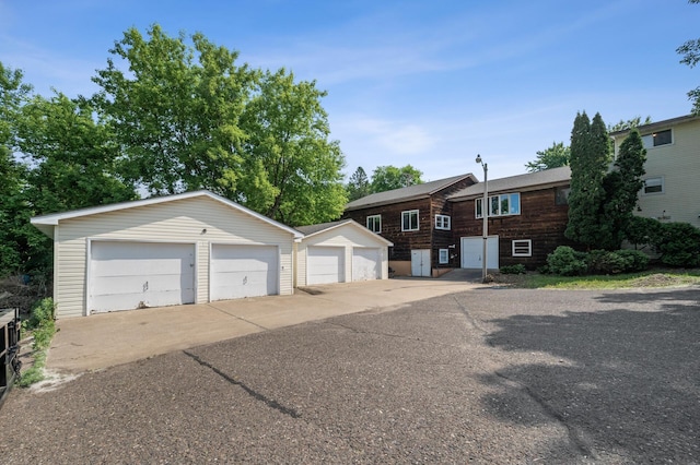 132 Middle School Dr, Saint Croix Falls, WI 54024 - view of front of property with an outbuilding and a detached garage