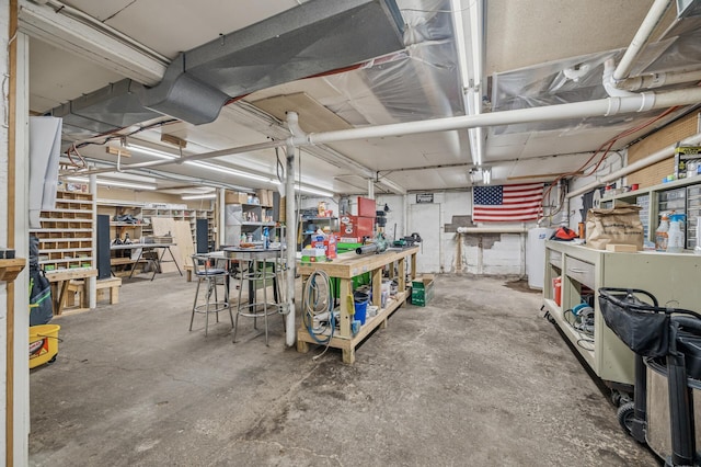 132 Middle School Dr, Saint Croix Falls, WI 54024 - basement with a workshop area and water heater