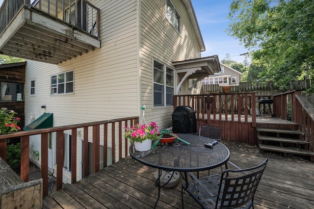 132 Middle School Dr, Saint Croix Falls, WI 54024 - wooden terrace featuring a grill and outdoor dining area