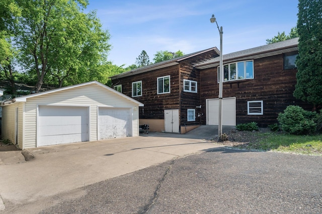 132 Middle School Dr, Saint Croix Falls, WI 54024 - view of side of home with an outbuilding and a detached garage