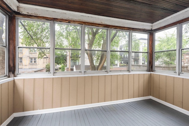 3225 Hennepin Ave, Minneapolis, MN 55408 - unfurnished sunroom with hardwood / wood-style floors, baseboards, and wood walls