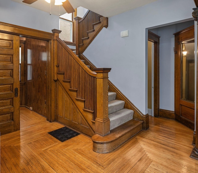 3225 Hennepin Ave, Minneapolis, MN 55408 - staircase featuring ceiling fan and baseboards