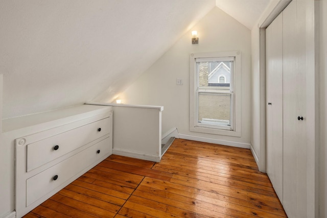 3225 Hennepin Ave, Minneapolis, MN 55408 - bonus room with lofted ceiling, wood-type flooring, and baseboards