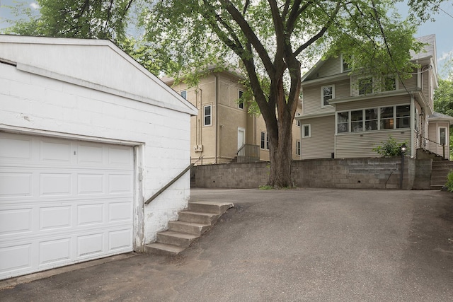 3225 Hennepin Ave, Minneapolis, MN 55408 - view of property exterior featuring a garage and concrete block siding