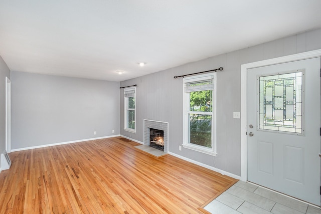 3101 Texas Ave S, Saint Louis Park, MN 55426 - unfurnished living room with light wood finished floors and a fireplace