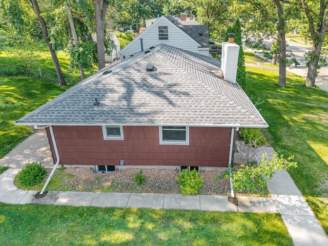 3101 Texas Ave S, Saint Louis Park, MN 55426 - view of side of property with a shingled roof, a chimney, and a yard