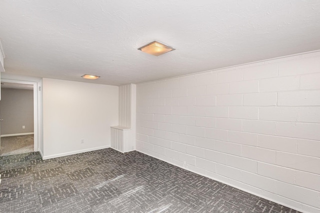 3101 Texas Ave S, Saint Louis Park, MN 55426 - finished basement with dark carpet, concrete block wall, and a textured ceiling