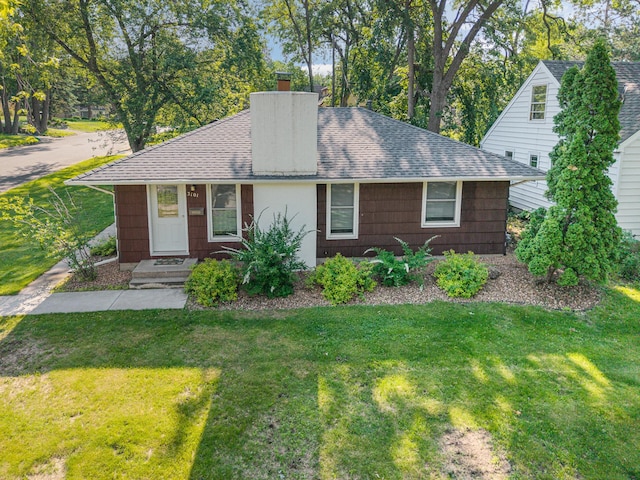 3101 Texas Ave S, Saint Louis Park, MN 55426 - view of front of house featuring a chimney, a front yard, and roof with shingles