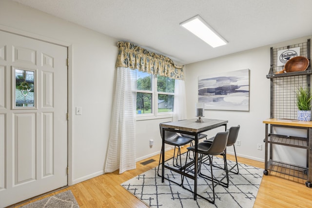 902 Ridge Dr SE, Saint Michael, MN 55376 - dining space featuring light wood-style floors and baseboards