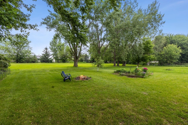 902 Ridge Dr SE, Saint Michael, MN 55376 - view of grassy yard with an outdoor fire pit
