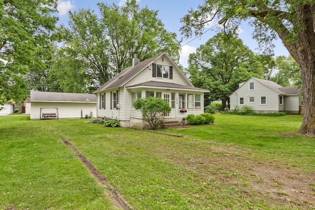 1039 9th Ave SW, Faribault, MN 55021 - back of house featuring a chimney and a lawn
