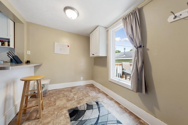 1039 9th Ave SW, Faribault, MN 55021 - washroom with baseboards and light stone finish floors