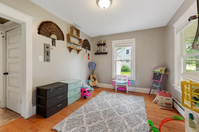 1039 9th Ave SW, Faribault, MN 55021 - recreation room with wood finished floors and baseboards