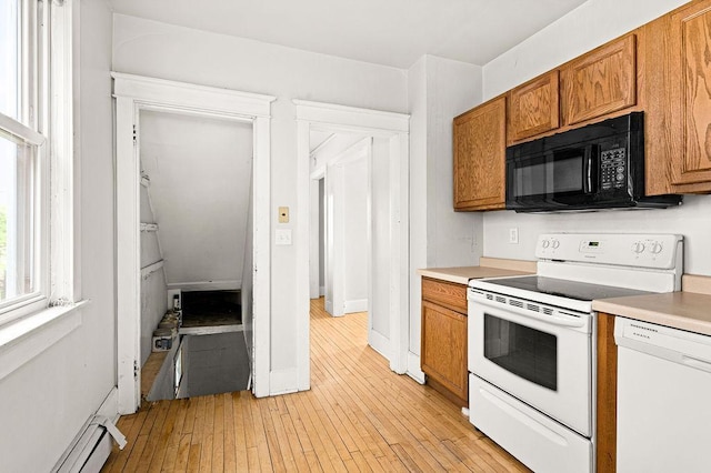 1901 5th St, Duluth, MN 55812 - kitchen featuring white appliances, a baseboard radiator, brown cabinets, and light countertops