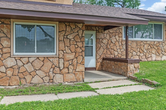495 Saint Anthony Ave, Saint Paul, MN 55103 - view of exterior entry with stone siding and roof with shingles