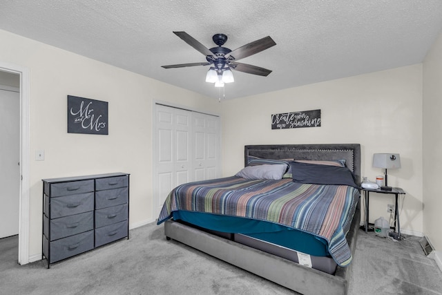 495 Saint Anthony Ave, Saint Paul, MN 55103 - carpeted bedroom featuring a closet, ceiling fan, and a textured ceiling