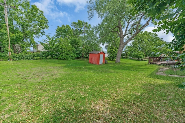 495 Saint Anthony Ave, Saint Paul, MN 55103 - view of grassy yard with a storage unit and a deck