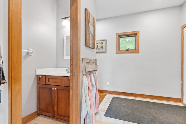 10390 Fenner Ave SE, Franklin Twp, MN 55328 - bathroom featuring vanity, wood finished floors, and baseboards