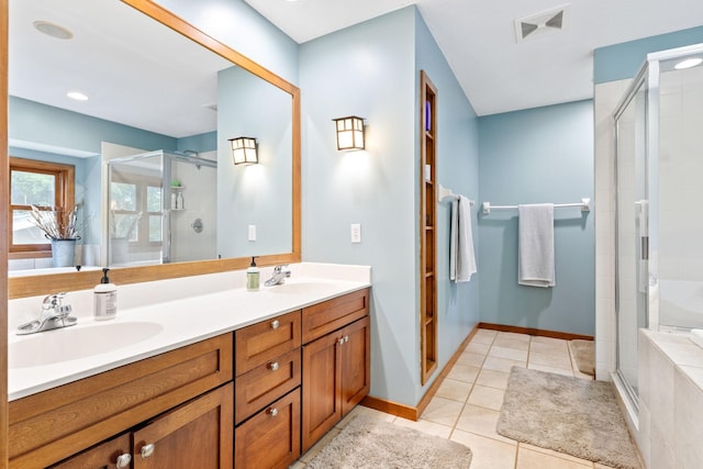 10390 Fenner Ave SE, Franklin Twp, MN 55328 - full bath featuring a stall shower, double vanity, tile patterned floors, and baseboards