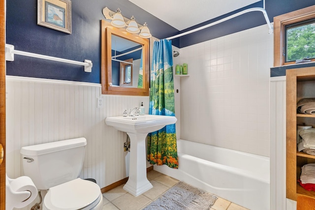 10390 Fenner Ave SE, Franklin Twp, MN 55328 - full bath featuring tile patterned flooring, toilet, shower / tub combo, and wainscoting