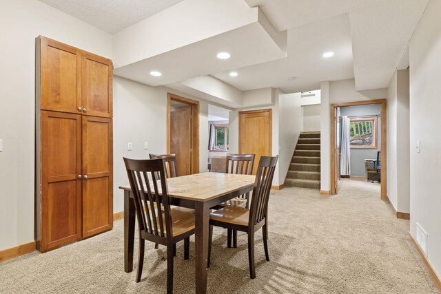 10390 Fenner Ave SE, Franklin Twp, MN 55328 - dining room featuring light colored carpet, stairway, baseboards, and recessed lighting