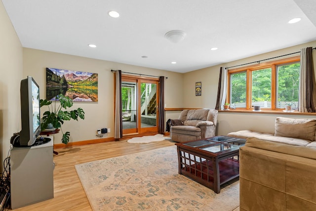 10390 Fenner Ave SE, Franklin Twp, MN 55328 - living room featuring healthy amount of natural light, light wood finished floors, baseboards, and recessed lighting