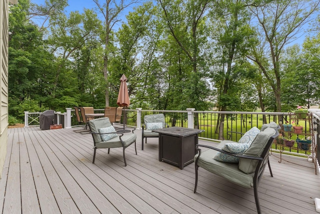 10390 Fenner Ave SE, Franklin Twp, MN 55328 - deck with view of scattered trees and an outdoor living space with a fire pit