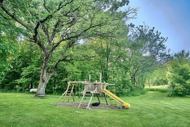 10390 Fenner Ave SE, Franklin Twp, MN 55328 - view of green lawn with a playground