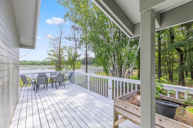 8996 Little Pelican Dr, Pelican Twp, MN 56472 - wooden deck featuring outdoor dining space and a water view