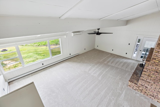 8996 Little Pelican Dr, Pelican Twp, MN 56472 - unfurnished living room featuring light carpet, ceiling fan, a wall mounted AC, a baseboard radiator, and lofted ceiling