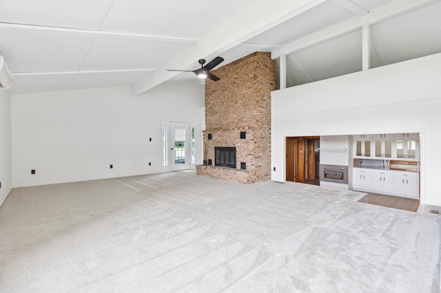 8996 Little Pelican Dr, Pelican Twp, MN 56472 - unfurnished living room with a brick fireplace, ceiling fan, beam ceiling, high vaulted ceiling, and carpet