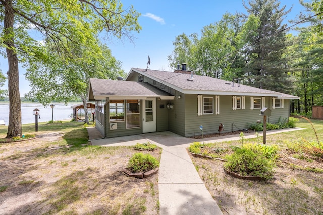 8996 Little Pelican Dr, Pelican Twp, MN 56472 - view of front of home featuring a shingled roof and a water view