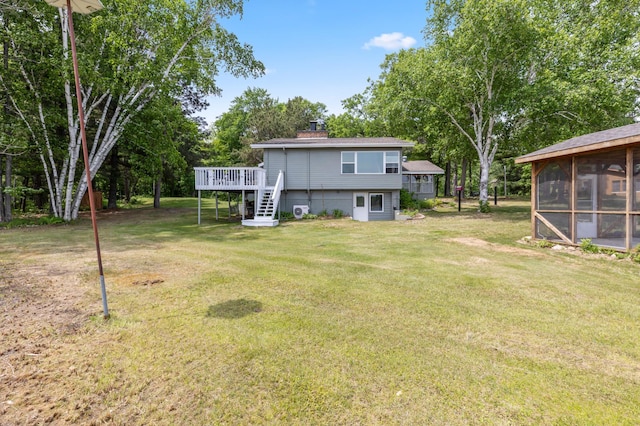 8996 Little Pelican Dr, Pelican Twp, MN 56472 - view of green lawn with a sunroom, a deck, and view of wooded area